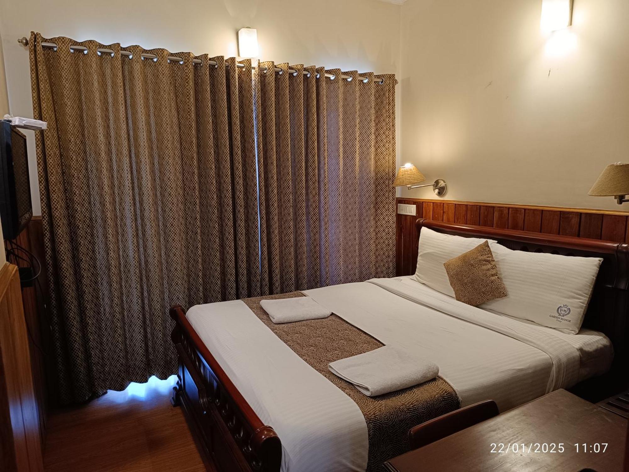 Готель Garden Manor Уті Номер фото
